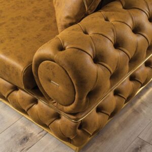 GlamTuft Sofa detail shot – gold-tone steel bar accent with wooden legs GlamTuft Sofa detail shot – gold-tone steel bar accent with wooden legs