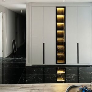 LED-lit central mirror wardrobe with matte black handles