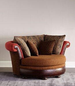 Traditional classic chair with rolled arms and deep cushioning Traditional classic chair with rolled arms and deep cushioning