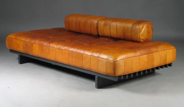 Sleek modern lounger with plush cushioned seat Sleek modern lounger with plush cushioned seat