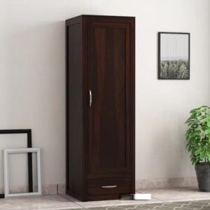 Space-saving wardrobe acting as a room divider in a studio apartment