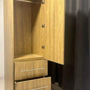 Space-saving wardrobe acting as a room divider in a studio apartment