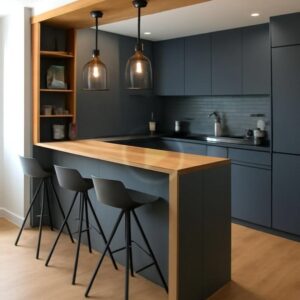 Modern custom-designed luxury kitchen in Dubai featuring matte dark grey cabinetry, warm wooden breakfast bar, pendant lighting, integrated shelving, and minimalist contemporary interior design.