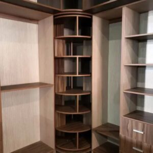 Classic walnut walk in wardrobe UAE, luxury wardrobe Dubai villa, corner wardrobe carousel UAE, traditional closet design Sharjah, premium dressing room Abu Dhabi