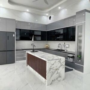 Modern custom-designed luxury kitchen in Dubai featuring matte dark grey cabinetry, warm wooden breakfast bar, pendant lighting, integrated shelving, and minimalist contemporary interior design. Modern custom-designed luxury kitchen in Dubai featuring matte dark grey cabinetry, warm wooden breakfast bar, pendant lighting, integrated shelving, and minimalist contemporary interior design.